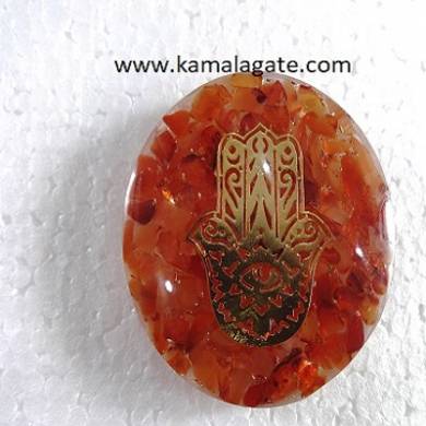 red carnelian orgone dome with hamsa symbol